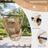 Hanging rope swing chair in beige with soft pillow and cushions, featuring sturdy metal support bar for outdoor.