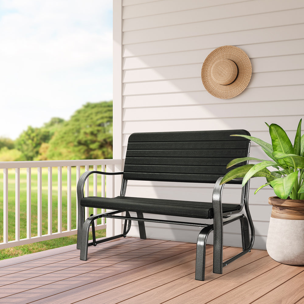 Black 2-seat porch glider with ergonomic backrest and steel frame, perfect for backyard or garden relaxation.
