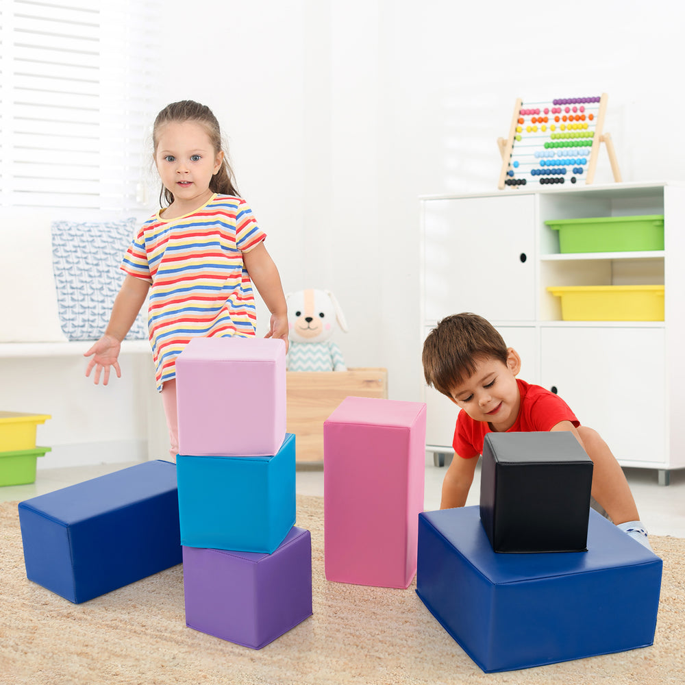 Two children playing with colorful foam building blocks, enhancing creativity and motor skills through imaginative play.