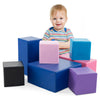 Brightly colored 7-piece foam building blocks arranged creatively, enhancing toddlers' motor skills and imaginative.
