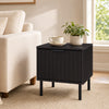 Black modern nightstand with a sleek black finish and a compact design, ideal for enhancing small living spaces.