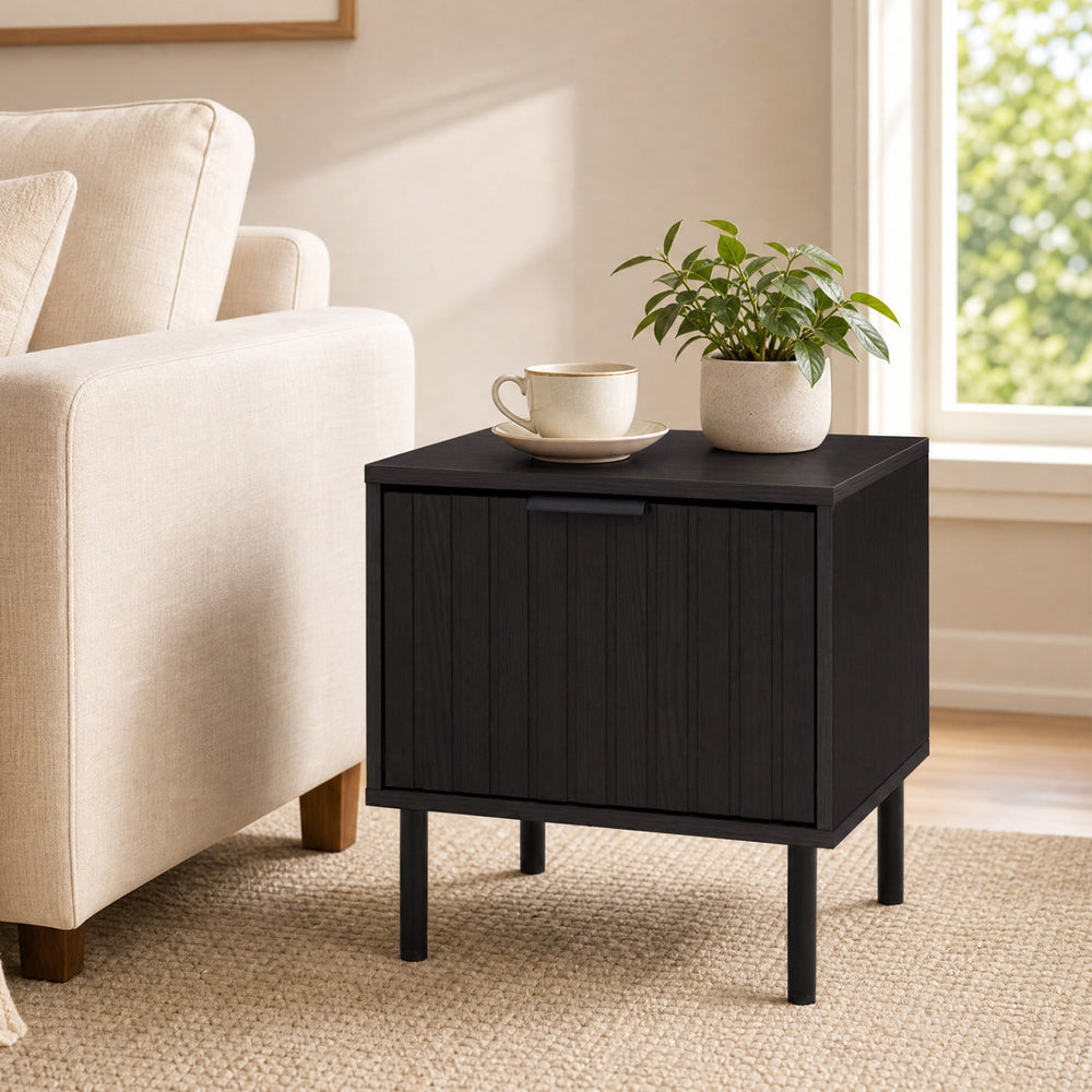 Black modern nightstand with a sleek black finish and a compact design, ideal for enhancing small living spaces.