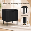 Black modern nightstand featuring a vertical-striped storage drawer and heavy-duty legs for stability in compact spaces.