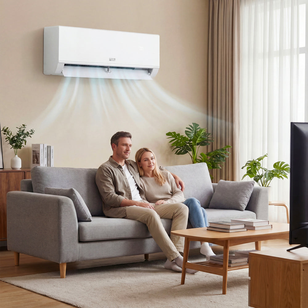 Couple relaxing on a sofa with the Blast Pro Series 18000 BTU mini split air conditioner, showcasing efficient cooling.