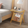 Boho end table with tempered glass top and rattan magazine rack, perfect for bedside or living room use.