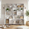White bookshelf with open shelving and 3 doors, featuring metal legs and anti-tipping kits for home office organization.