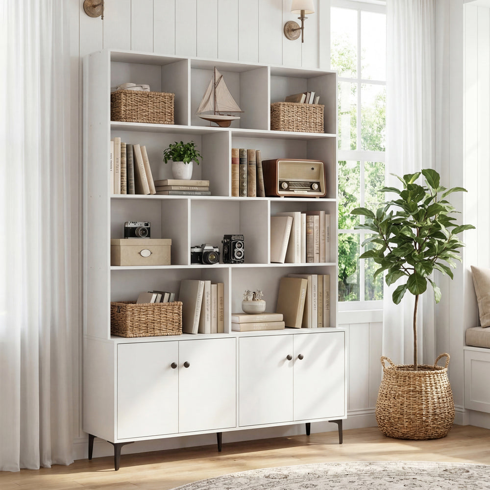 White bookshelf with open shelving and 4 doors, featuring metal legs and anti-tipping kits for home office use.