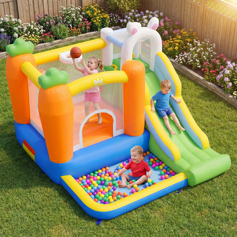 Colorful bounce house with climbing wall, slide, and ball pit for kids aged 3-12, perfect for backyard parties.
