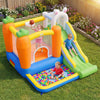 Brightly colored bounce house with climbing wall, slide, and ball pit for kids' outdoor fun and backyard parties.