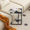 C-shaped side table in dark gray with a spacious tabletop, perfect for snacks and drinks beside a couch.