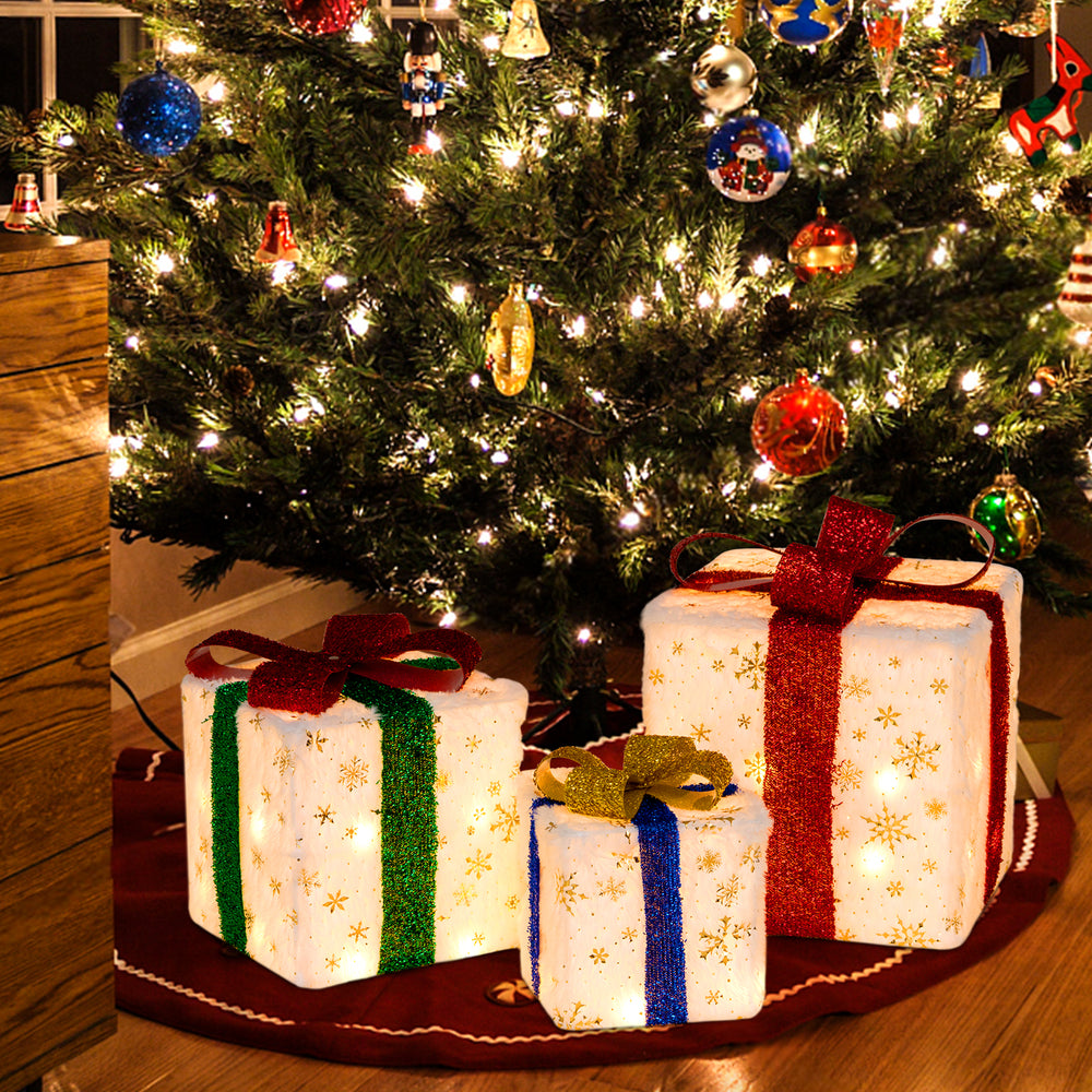 Medium-sized lighted Christmas gift box with blue ribbon and snowflake design, featuring 48 warm lights for holiday.