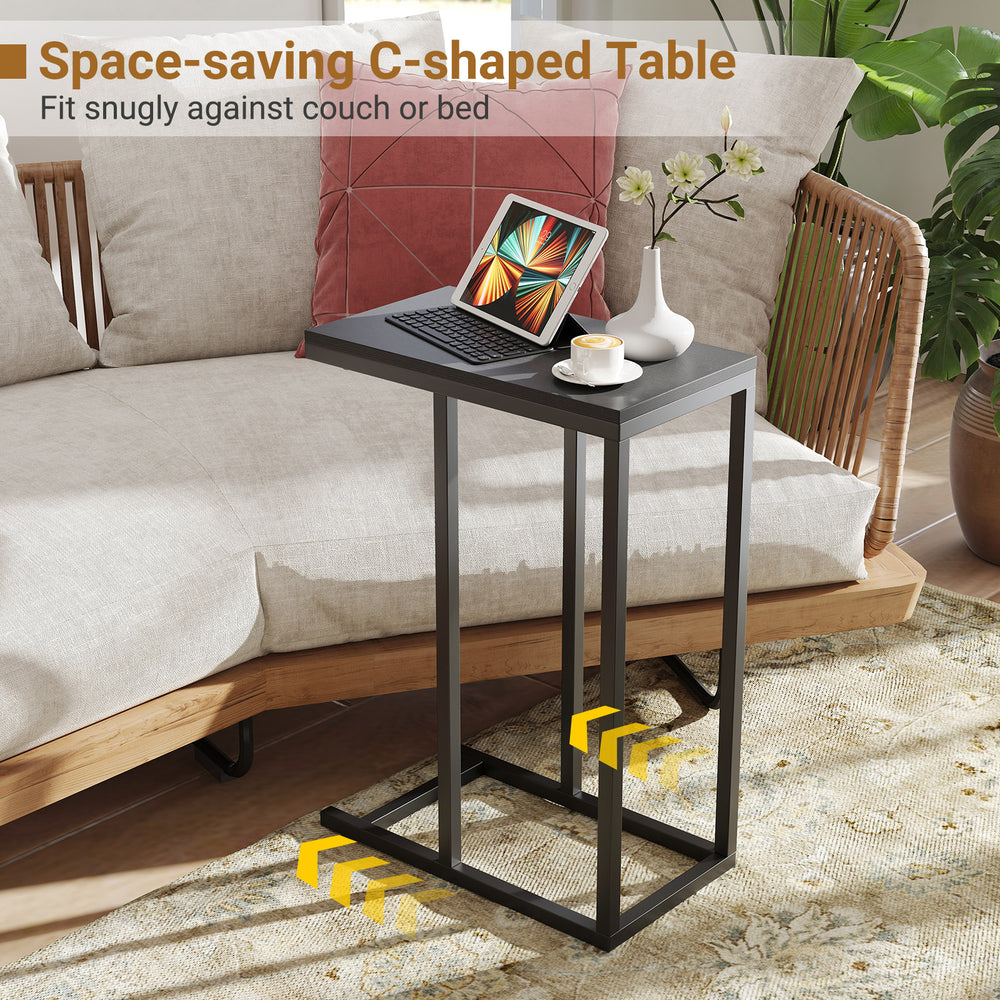 C-shaped end table with metal legs, designed to fit snugly against couch or bed for coffee and laptop use.