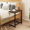 C-shaped mobile bedside table in rustic brown with wheels, built-in phone slot, and spacious tabletop for convenience.