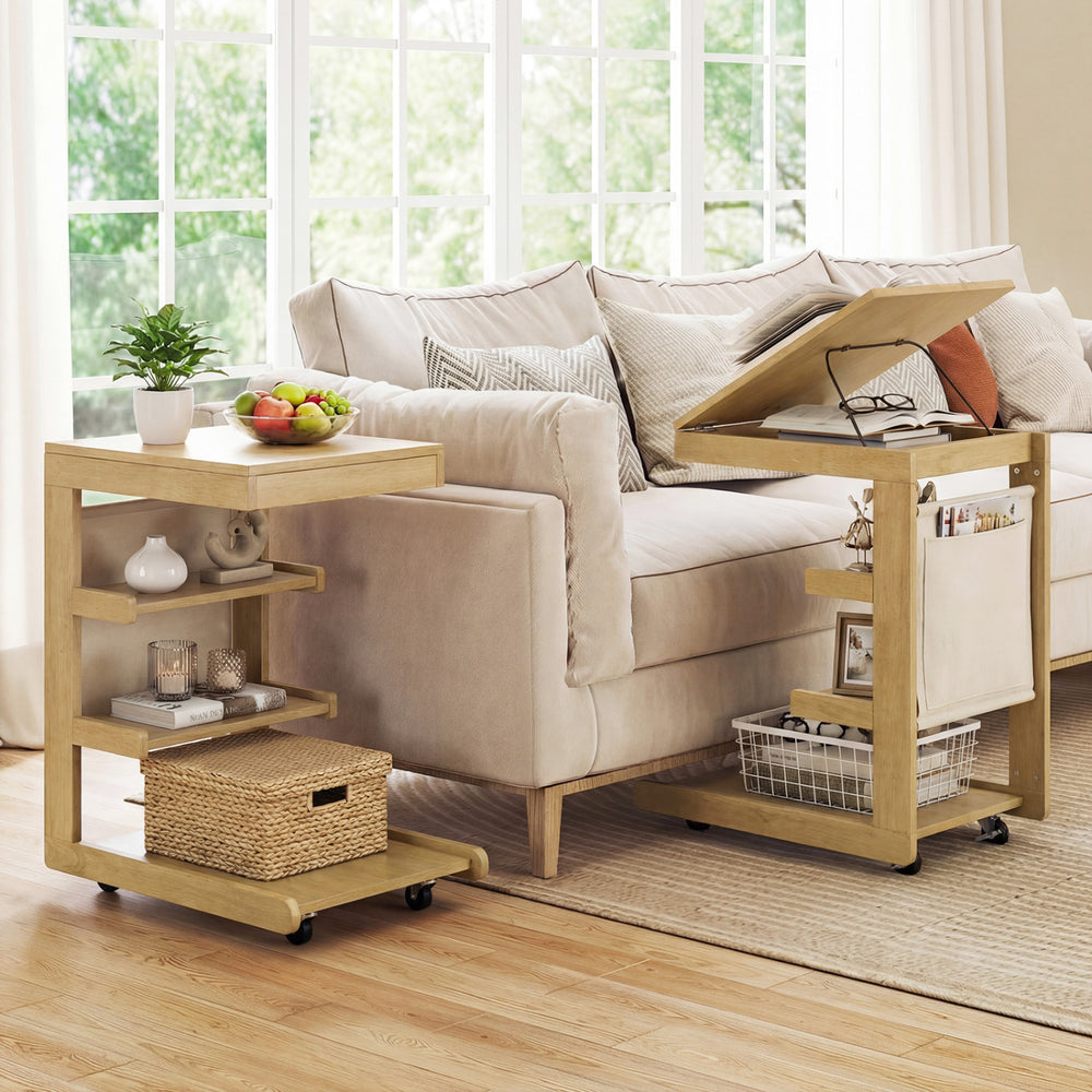 C-shaped end table with wheels, adjustable desktop, and open shelves for easy access beside a sofa in natural wood.