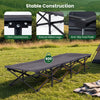 Camping cot in gray with padded pillow, robust metal legs, and side storage pouch for convenient outdoor relaxation.