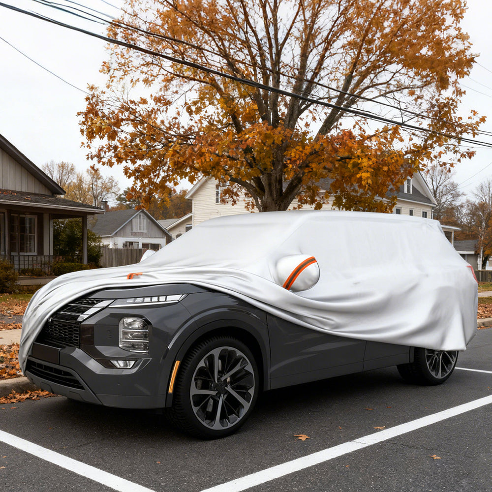 Car cover for SUVs up to 200 inches, offering UV, rain, and dust protection with mirror pockets and reflective strips.