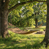 Spreader bar hammock in khaki, comfortably fits 2 people, perfect for relaxing in outdoor spaces like patios or.