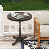 Round patio dining table in bronze with a sturdy cross-shaped base, perfect for poolside or backyard dining.