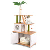 Cat tower with hidden washroom in white, featuring scratching posts, cozy condo, and decorative faux leaves for indoor.