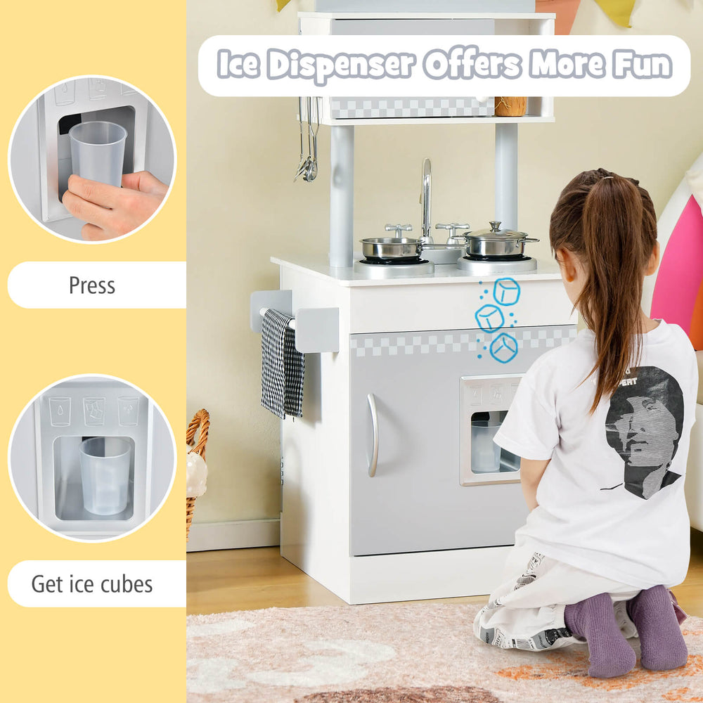 Toddler playing with the Chef Pretend Kitchen Playset, featuring an ice dispenser and cooking accessories for.