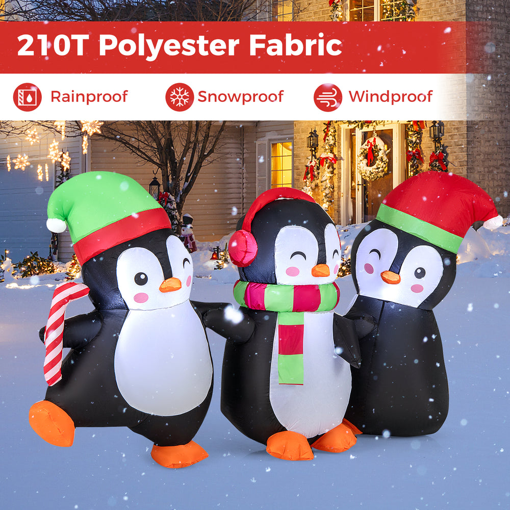 Christmas inflatable penguin family with LED lights, made of durable polyester fabric, perfect for festive outdoor.