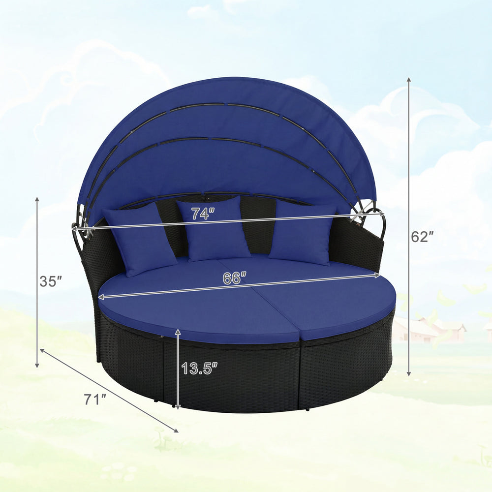 Clamshell patio round daybed in blue wicker with retractable canopy and pillows, ideal for outdoor relaxation.