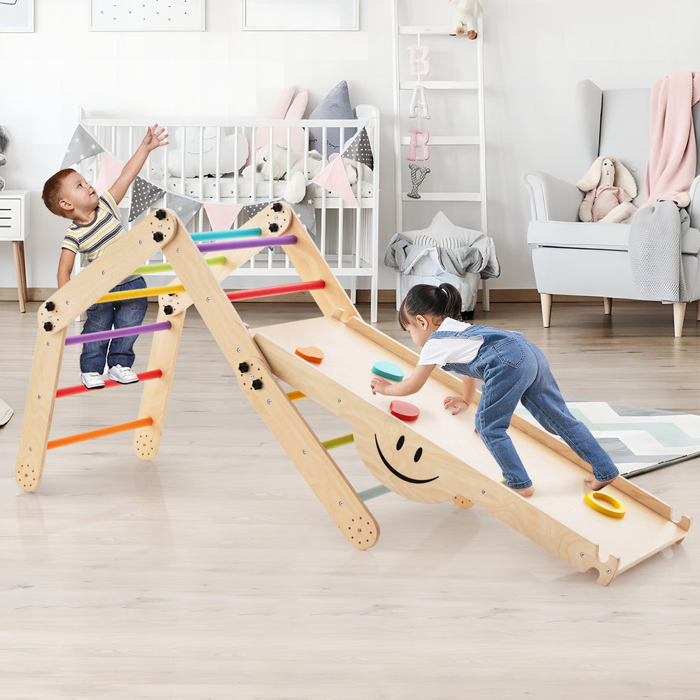 Climbing triangle ladder toy with reversible ramp, colorful rock embellishments, for indoor play and muscle training.