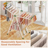 Clothes drying rack in beige with height adjustable wings, featuring 28 clips and 4 shoe holders for efficient drying.