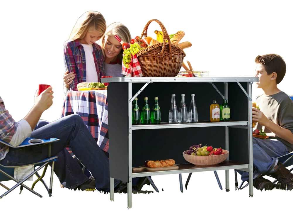 Folding camping table with 2-tier shelves, made of aluminum, ideal for outdoor BBQs and picnics, shown in use.