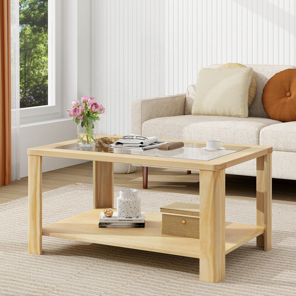 Natural wood 2-tier coffee table with tempered glass top, featuring a spacious lower shelf for magazines and decor.