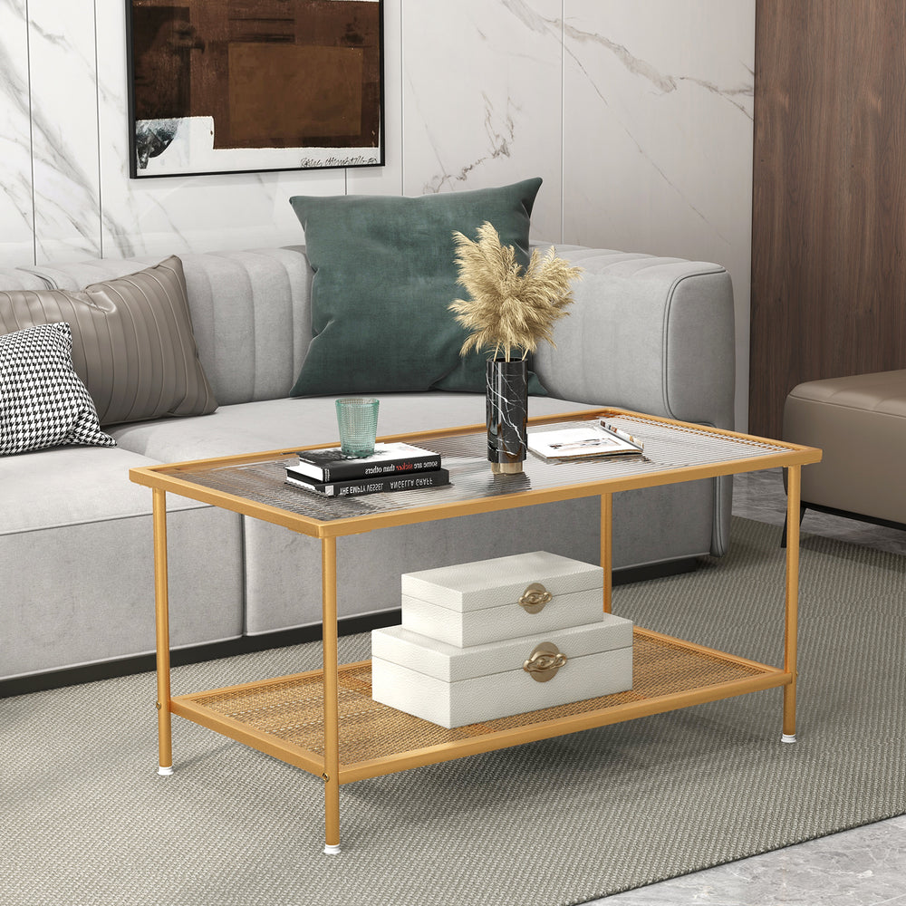 2-tier coffee table with a golden frame and tempered glass top, featuring a shelf for storage in a stylish living room.