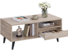 Rustic rectangle coffee table highlighting a smooth drawer operation and stylish splayed support legs for modern living.