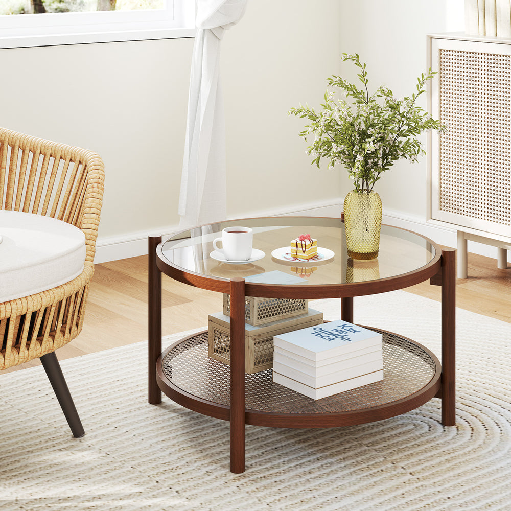 Round coffee table with a solid wood frame and tempered glass top, featuring a hand-woven rattan shelf for stylish.