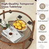 Round coffee table showcasing a sleek tempered glass surface and a stylish hand-woven rattan shelf, ideal for cozy.