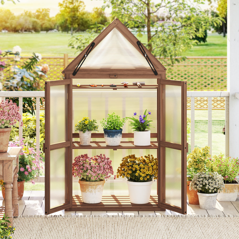 Mini wooden greenhouse with transparent panels and sloping roof, featuring three removable shelves for plant care.