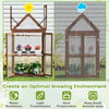 Cold frame mini wooden greenhouse showcasing a sloping roof design and double doors for optimal ventilation and rain.