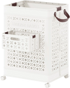 Collapsible laundry basket with a 20-gallon capacity, featuring a small hanging basket and wheels for easy mobility.