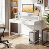 Compact white office desk with removable monitor shelf, dual-use drawer, and ergonomic design for versatile use.