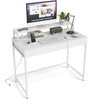 Compact white office desk with removable monitor shelf, built-in power strip, and dual-use drawer for versatile.