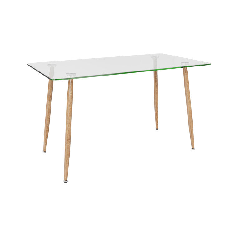 Elegant glass dining table with wooden legs, featuring a modern design for dining rooms or kitchens.