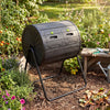Compost tumbler with dual chambers, 37.5-gallon capacity, and a sturdy metal frame for efficient outdoor composting.