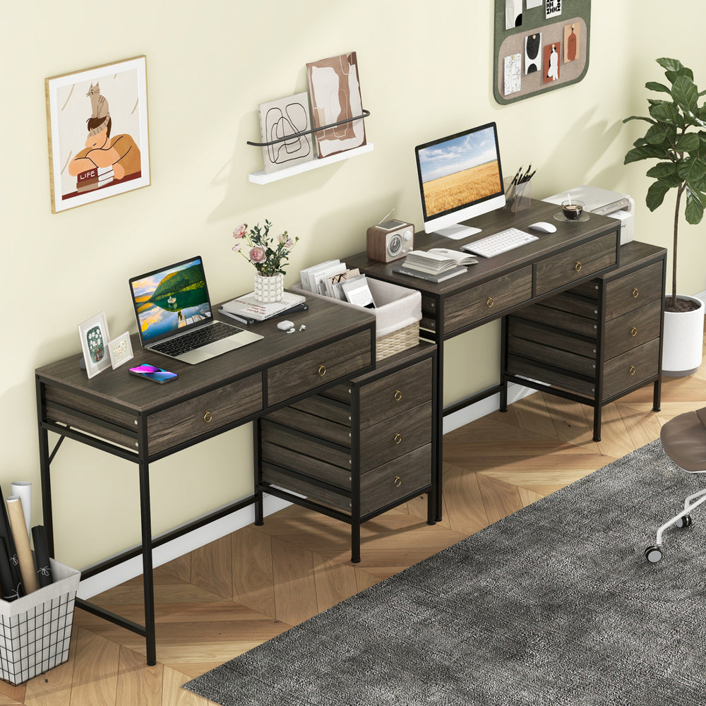 Computer desk with grey wood finish and black metal frame, featuring 5 drawers for ample storage in a home office setup.