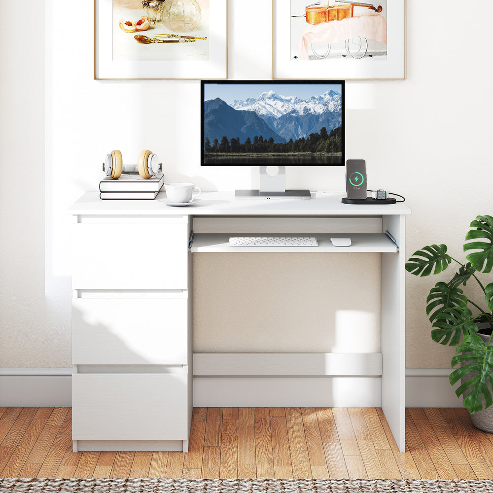 Computer desk in white with keyboard tray, three drawers, and built-in power outlet for home office organization.