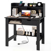 Computer desk in black featuring power outlets, USB ports, and a spacious hutch for organized workspace in any room.