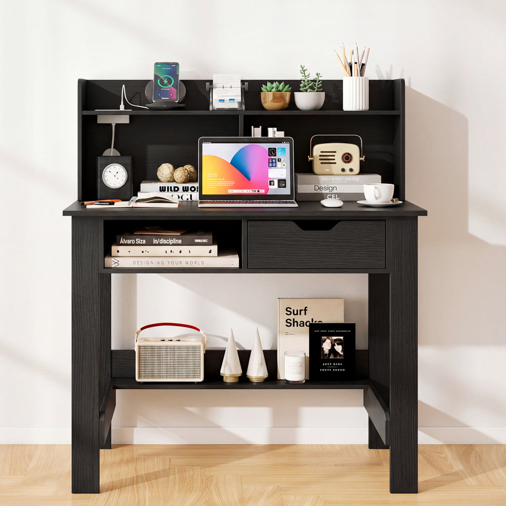 Black computer desk featuring power outlets, USB ports, and a spacious hutch for organized workspace in any room.