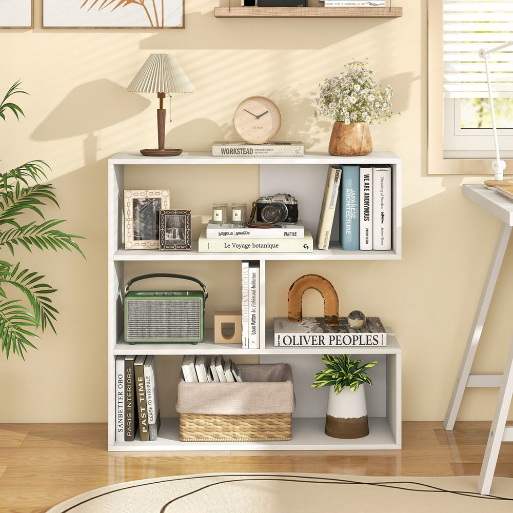 Concave bookshelf in white featuring 3 open shelves, anti-toppling devices, and a geometric design for versatile storage.