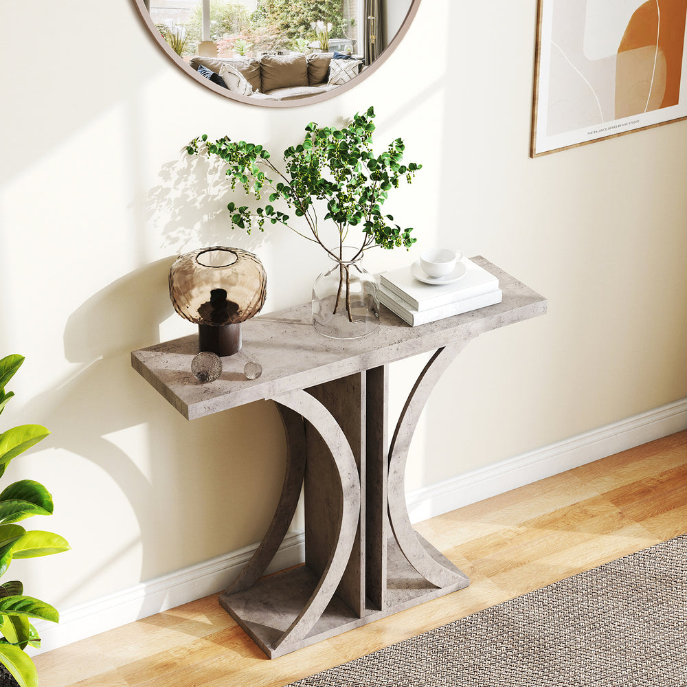 Gray console table with geometric frame, featuring abundant display space for plants and photos, ideal for entryways.