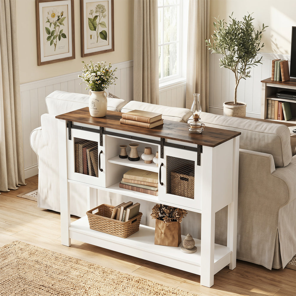 Console table with rustic brown top and white frame, featuring sliding barn doors and adjustable shelves for versatile.