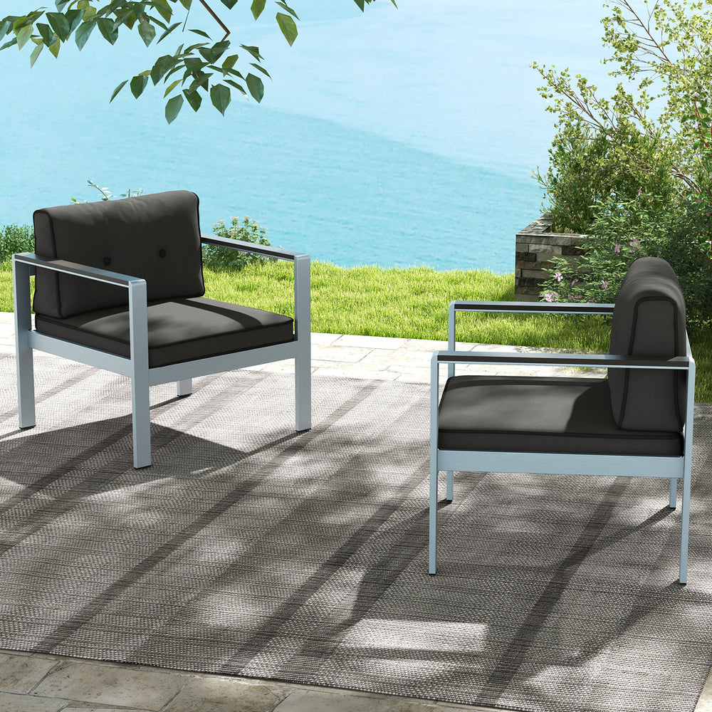 Contemporary gray sofa chairs with WPC armrests and cushions, perfect for outdoor relaxation by the water.