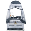 Convertible bassinet in grey with removable changing table, mesh canopy, and toys, ideal for infants up to 3 years.